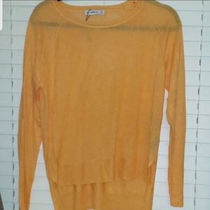 Orange sweater with side slits
